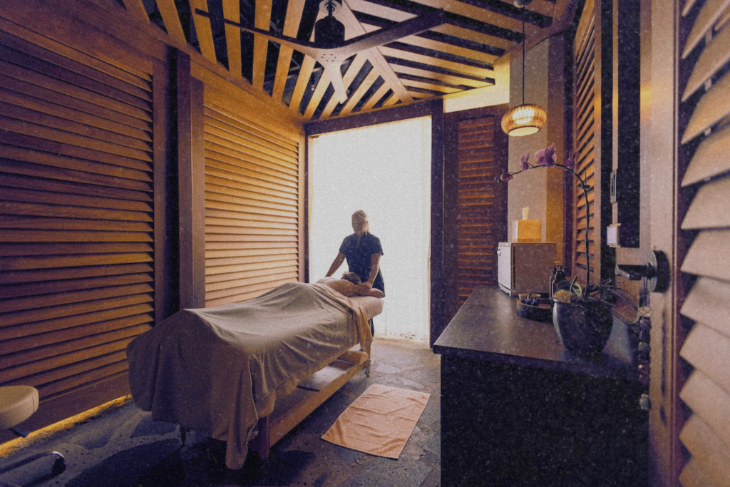 A person receiving a relaxing massage at The Ritz-Carlton, Turtle Bay spa in Oahu—ideal for a peaceful Oahu itinerary.